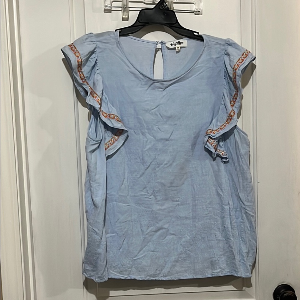 Elegant Blue Ruffled Blouse with Flowing Design
